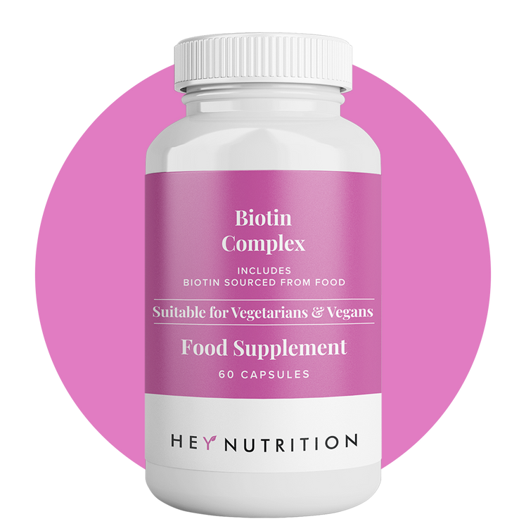Biotin Complex product front with circle background – A bottle of Hey Nutrition Biotin Complex 60 capsules food supplement, shown against a pink circle backdrop.