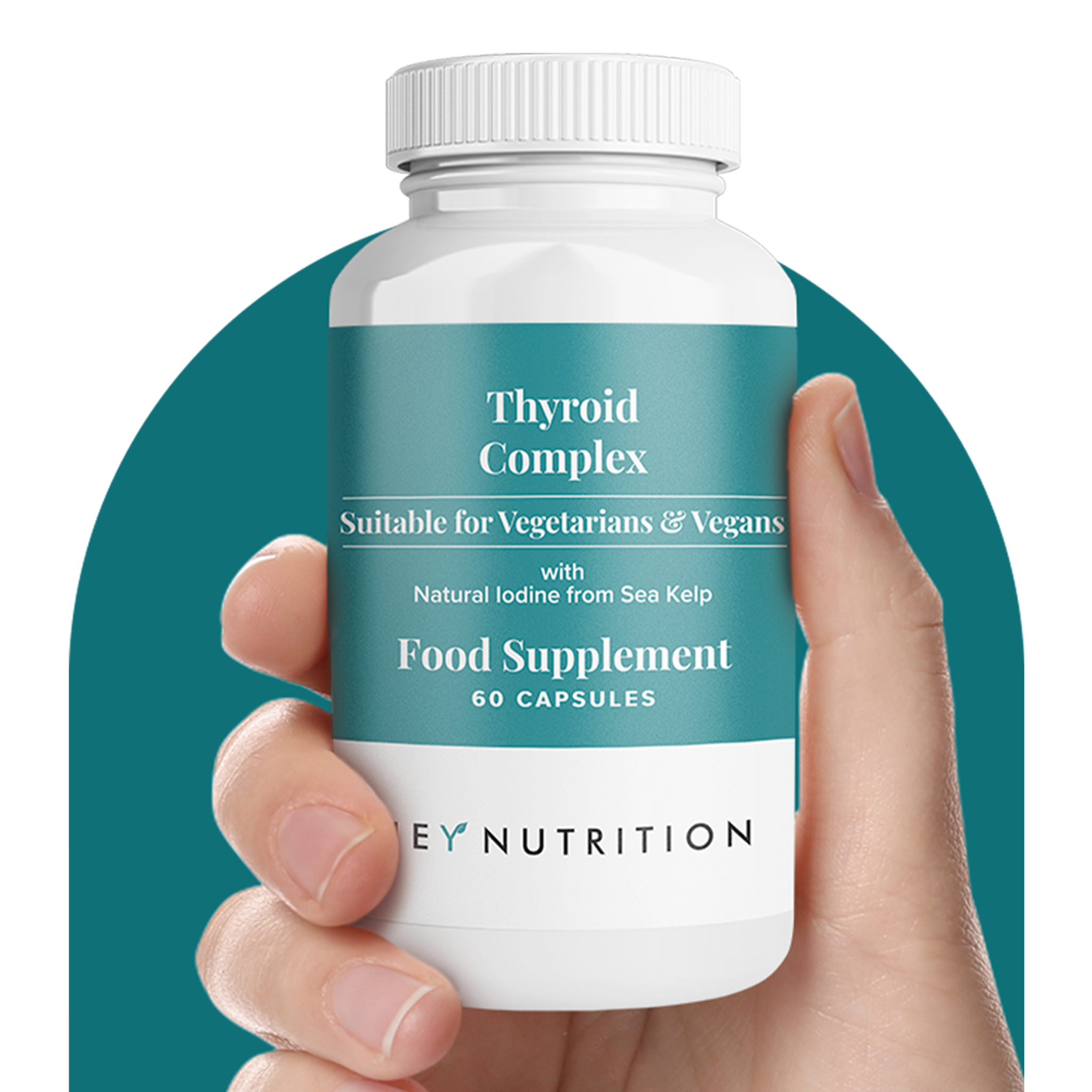 Hand holding a bottle of Hey Nutrition Thyroid Complex food supplement with natural iodine from sea kelp.