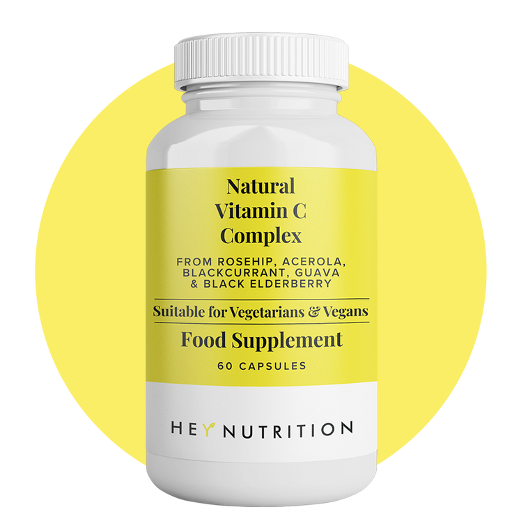 Hey Nutrition Natural Vitamin C Complex supplement bottle with a yellow label on a yellow circle background.